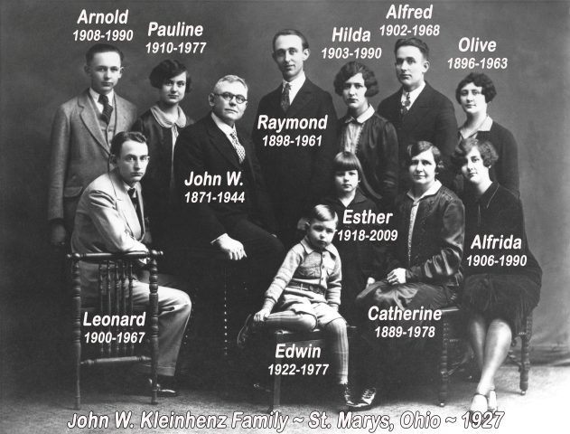 The John W. Kleinhenz Family. 1927. The photos on this page pertain to these people. Photo likely taken at 518 West Jackson Street in St. Marys, Ohio. Standing: Arnold, Pauline, Ray, Hilda, Alfred, Olive, Esther (behind Edwin) Seated: Leonard, John, Edwin, Catherine & Alfrida.