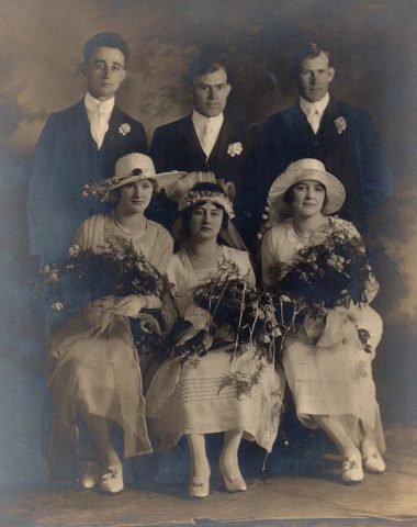 George & Olive Thieman Wedding. May 5, 1920. Standing L-R: Raymond Kleinhenz, George Thieman, Charles Thieman. Sitting L-R: Hilda Kaiser, Olive (Kleinhenz) Thieman, Hilda Kleinhenz. Source: Nancy (Golubic) Kleinhenz

Alfrida (Kleinhenz) Willke, Olive's younger sister, writes: When Olive married George in 1920 she had moved in with George's parents, Mr. & Mrs. Bernard Thieman. My association with grandpa and grandma Thieman that summer left many nice memories. Grandpa at 80 and grandma at 74 were still very keen and up-to-date. They loved and were interested in young people. So our love for each other was mutual.

Grandma Thieman usually would sit down with me the morning after I had been out the night before, wanting to know all about my evening out. Then she had some tales to tell me about her teenage days. One of her favorite sayings I found to be very true - "One never stands still; one either goes forward or backward."